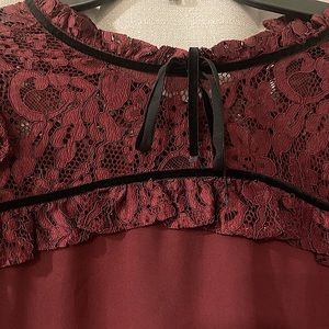 Burgundy and black lace blouse.